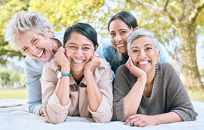 Buy stock photo Senior women and friends portrait on picnic in park for bonding, wellness and relaxing lifestyle. Happiness, joy and smile of elderly retirement people in interracial friendship in nature together.

