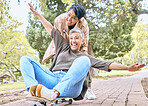Senior women, park and couple of friends together outdoor for comic fun on a skateboard while happy. People together in nature for bonding, happiness and relax on retirement holiday with support