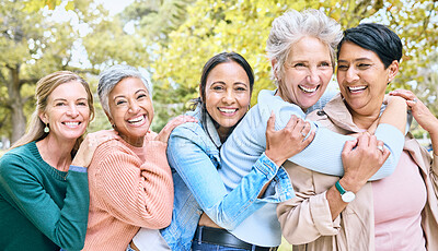 Buy stock photo Friends, park and group of women hug enjoying bonding, quality time and relax in nature together. Diversity, friendship and portrait of happy senior females with smile, embrace and peace outdoors