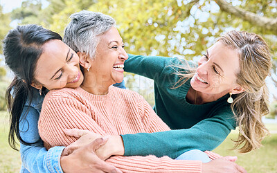 Buy stock photo Retirement hug, seniors and bonding women in nature park, grass garden or relax environment in trust, community or security. Smile, happy and elderly friends in embrace for support or birthday pride