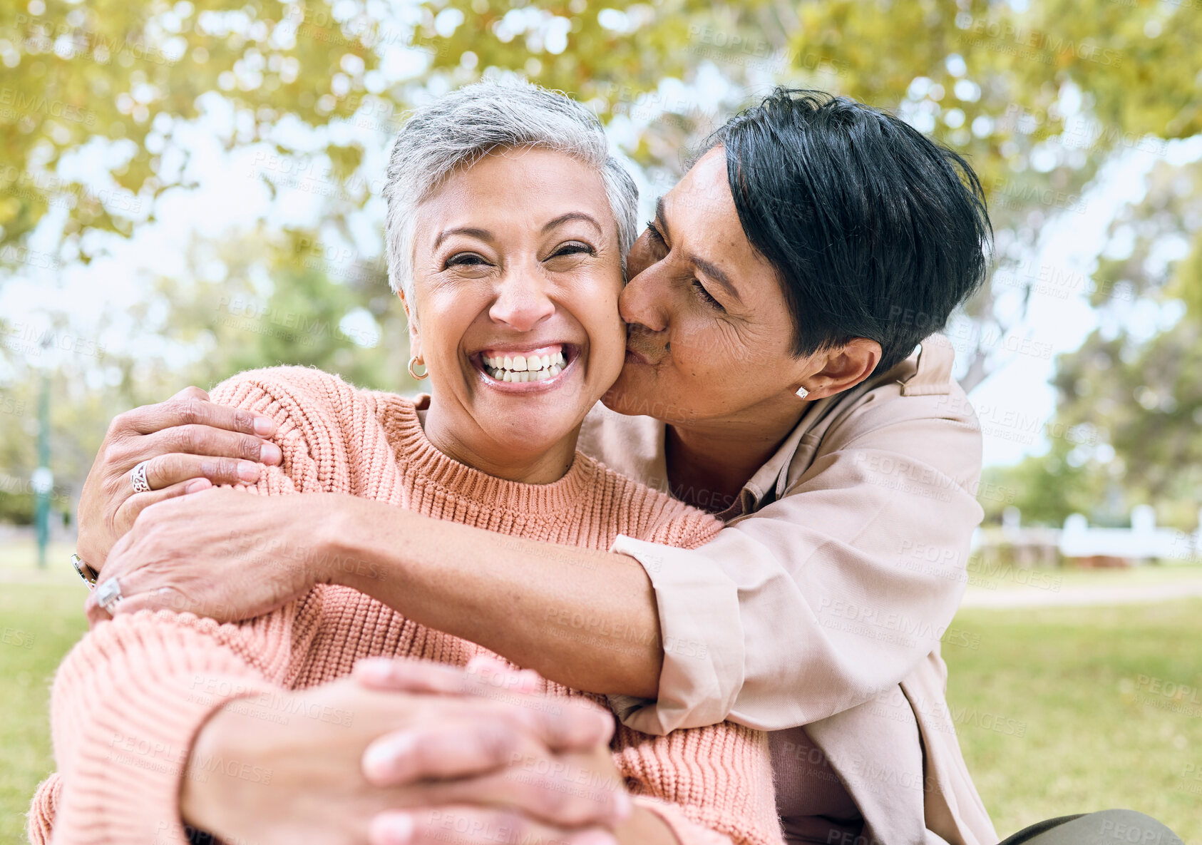 Buy stock photo Couple of friends, portrait or cheek kiss in nature park, grass garden or relax environment in support, love or retirement. Smile, happy or senior women in elderly bonding, fun embrace or trust hug