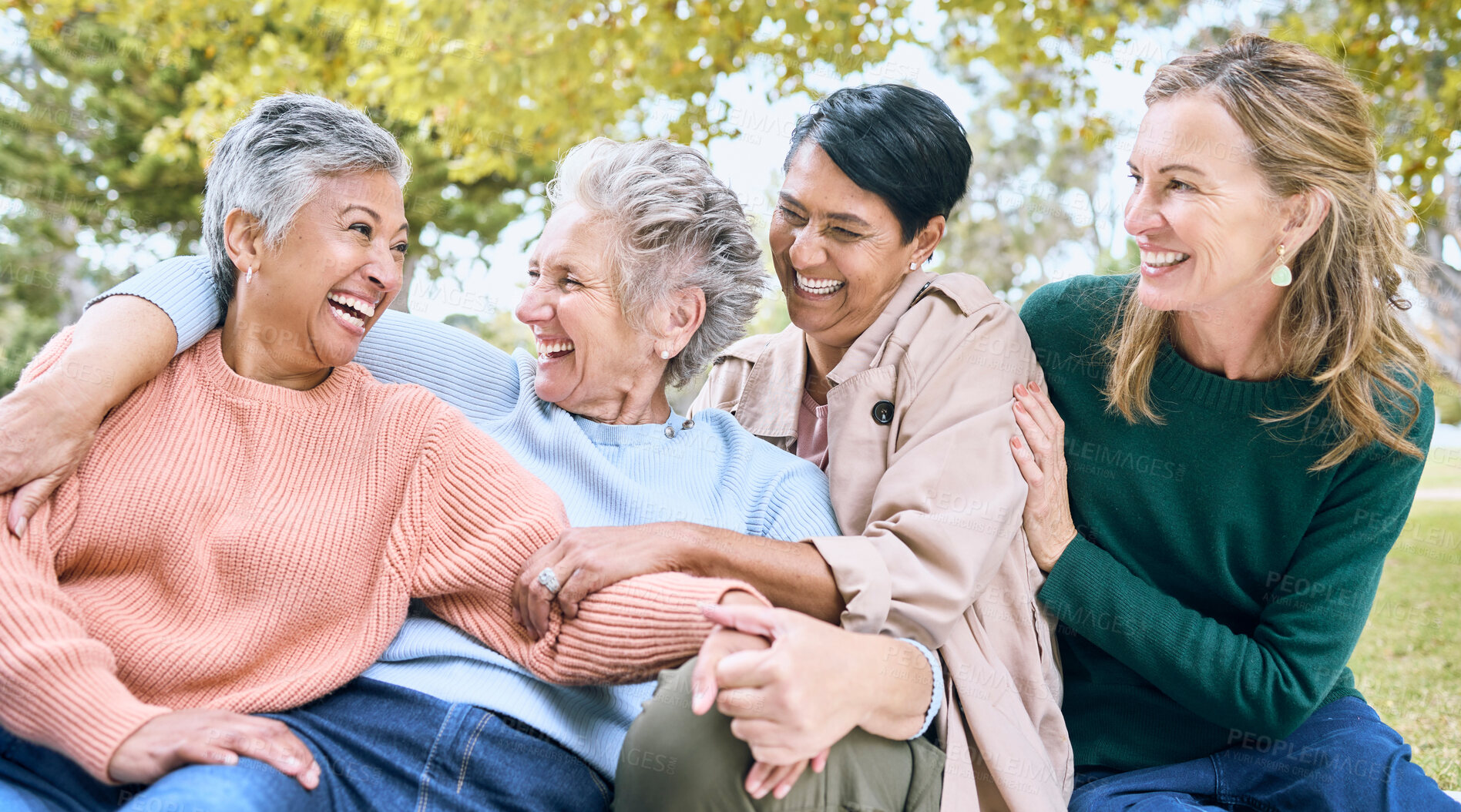 Buy stock photo Happy senior women, laughing or bonding in nature park, grass garden or relax environment in retirement, support or trust. Smile, diversity or elderly friends in comic joke, funny meme or emoji face