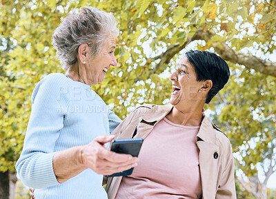 Buy stock photo Senior women, laughing or phone meme in nature park, garden or relax environment in retirement, support or trust. Smile, happy friends or elderly bonding with comic, crazy or funny joke on technology