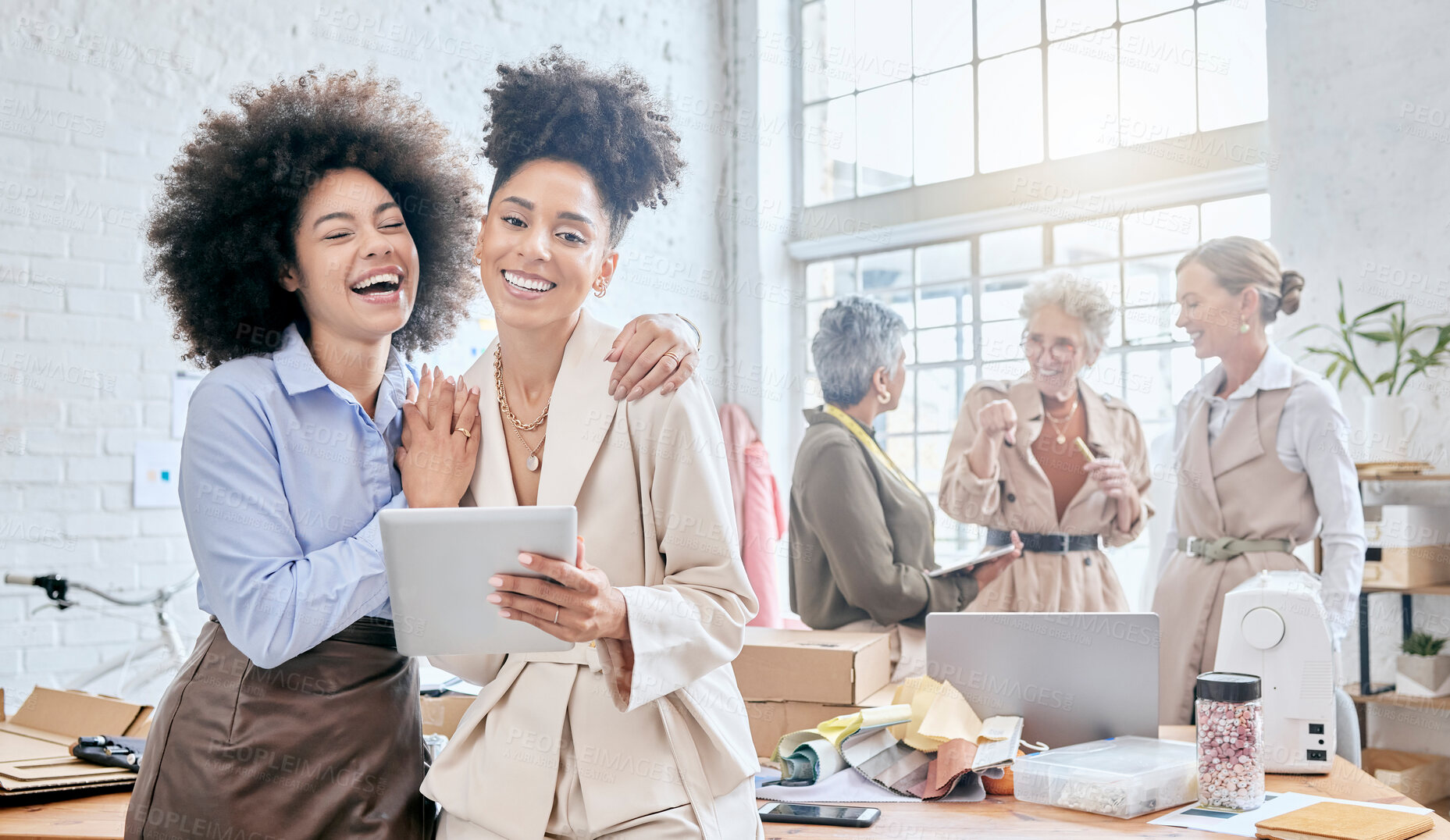 Buy stock photo Teamwork, tablet and laugh with a business black woman and colleague joking in their office for design. Collaboration, fun and creative with designer female friends working in a creative workshop