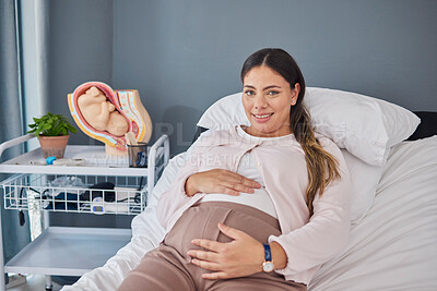 Buy stock photo Pregnant woman, doctor consultation office and portrait of a new mother ready for ultrasound. Hospital bed, medical clinic and mama smile with happiness hold her stomach at a healthcare consultation