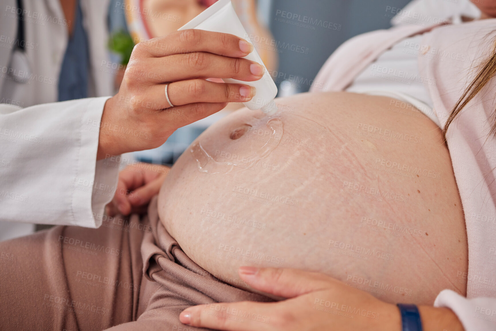 Buy stock photo Pregnant, woman and stomach with gel, doctor and checkup for baby health, scan and appointment. Medical professional, pregnancy and female belly, ultrasound and confirm growth, healthcare or wellness