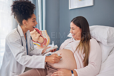 Buy stock photo Ultrasound doctor, woman excited and hospital bed with happiness, support and family planning for future. Black woman medic, pregnant woman and medical tech consulting on stomach for wellness of baby