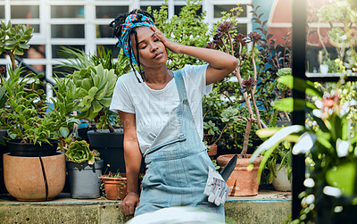 Buy stock photo Tired, gardener or black woman with headache, stress or burnout after cleaning dirty plants or flowers. Gardening, fatigue or exhausted girl resting after working on environmental maintenance job 
