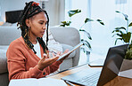 Black woman, laptop or student with tablet for education in living room for elearning, research or planning college scholarship. Confused girl with tech for internet, university or website search