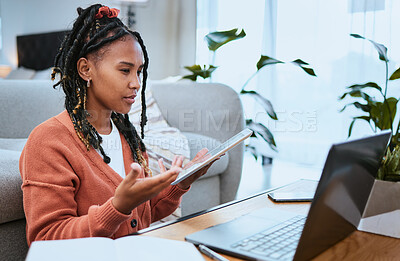 Buy stock photo Black woman, laptop or student with tablet for education in living room for elearning, research or planning college scholarship. Confused girl on video call for internet, university or website search