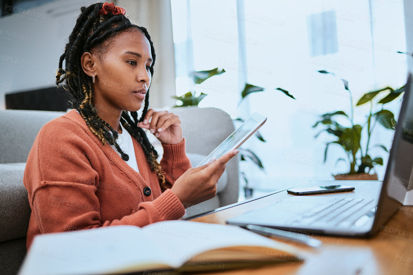 Buy stock photo Black woman, tablet and student reading on laptop for online email communication and planning college schedule in home office. African girl, thinking and digital tech devices for elearning education