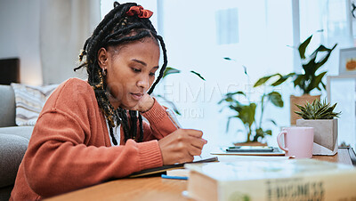 Buy stock photo Student, education and black woman with books for studying, learning and notes in academic class. University, college and female focus at desk doing homework, assignment and school project at home