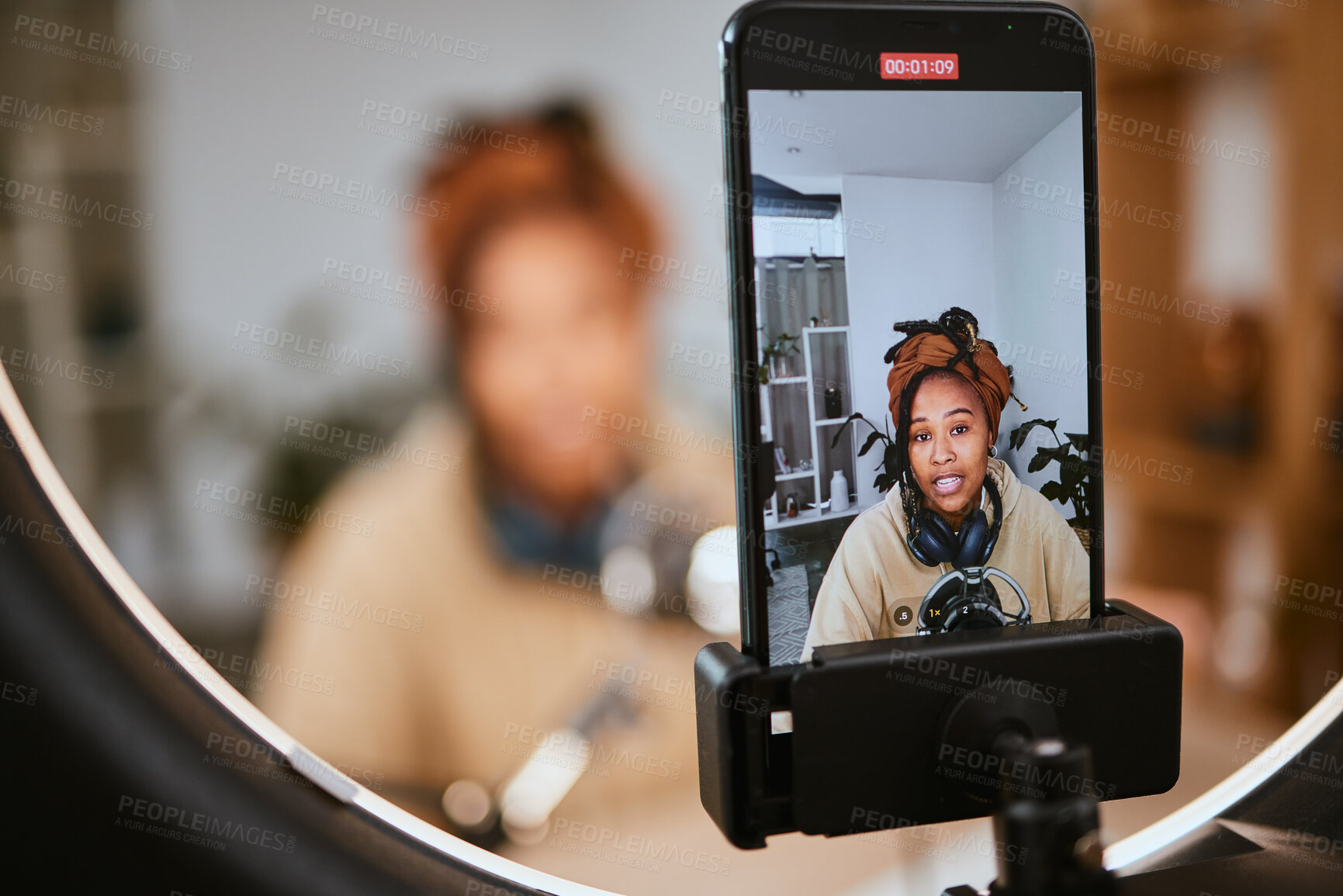Buy stock photo Communication, phone and black woman streaming podcast, radio talk show or speaker talking about teen culture. Online broadcast microphone, ring light or gen z influencer speaking about student news