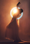 Orange lighting, art deco and silhouette of woman with neon circle for creative fashion, fantasy and beauty. Dance, aesthetic and shadow of girl pose for dream, magic and freedom in glowing studio
