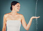 Woman, water and washing hand, smile and happy isolated on studio background, hygiene and skincare with beauty. Health, wellness and splash, natural cosmetics and body, shower and cleaning hands