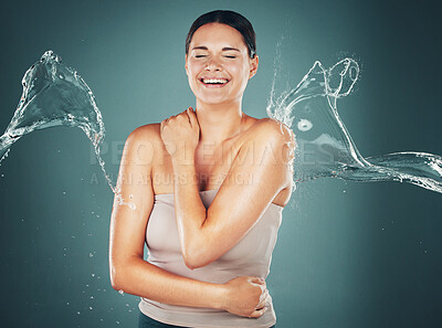 Buy stock photo Beauty, skin and skincare water splash on woman cleaning body for hygiene and hydration isolated in a studio background. Self care, wellness and female dermatology for young beautiful adult