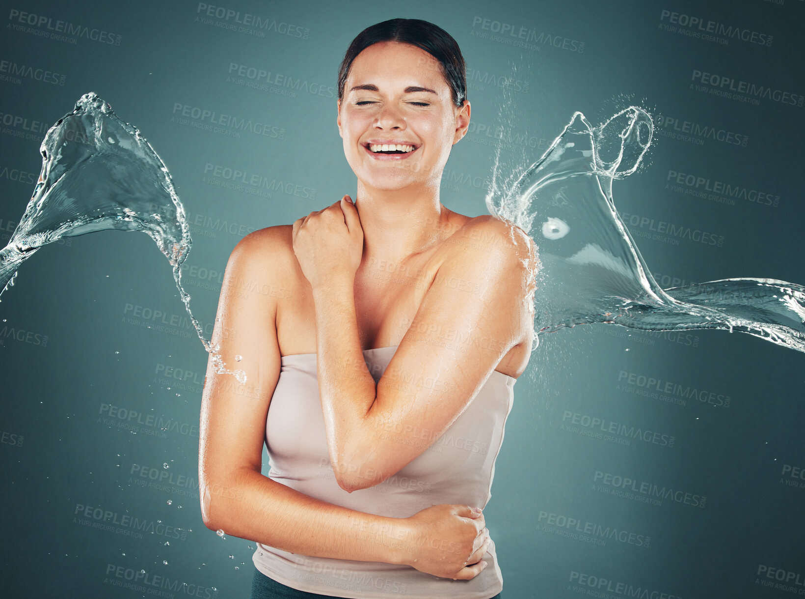 Buy stock photo Beauty, skin and skincare water splash on woman cleaning body for hygiene and hydration isolated in a studio background. Self care, wellness and female dermatology for young beautiful adult