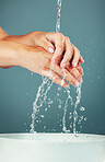 Woman, water and washing hand zoom isolated on studio background, hygiene and skincare with beauty. Health, wellness and liquid splash, natural cosmetics and body, shower and cleaning hands