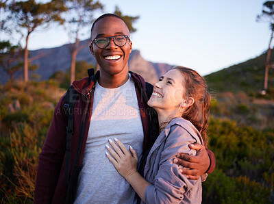 Buy stock photo Smile, nature and portrait of interracial couple on mountain for holiday, vacation and hiking adventure on weekend. Travel, dating and happy man hugging woman enjoy calm, outdoor freedom and peace