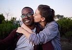 Kiss, interracial and portrait of a couple in nature for a date, walk or bonding in Portugal. Love, affection and black man and woman together with a romantic hug in a park or field to relax