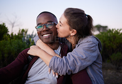 Buy stock photo Kiss, interracial and portrait of a couple in nature for a date, walk or bonding in Portugal. Love, affection and black man and woman together with a romantic hug in a park or field to relax