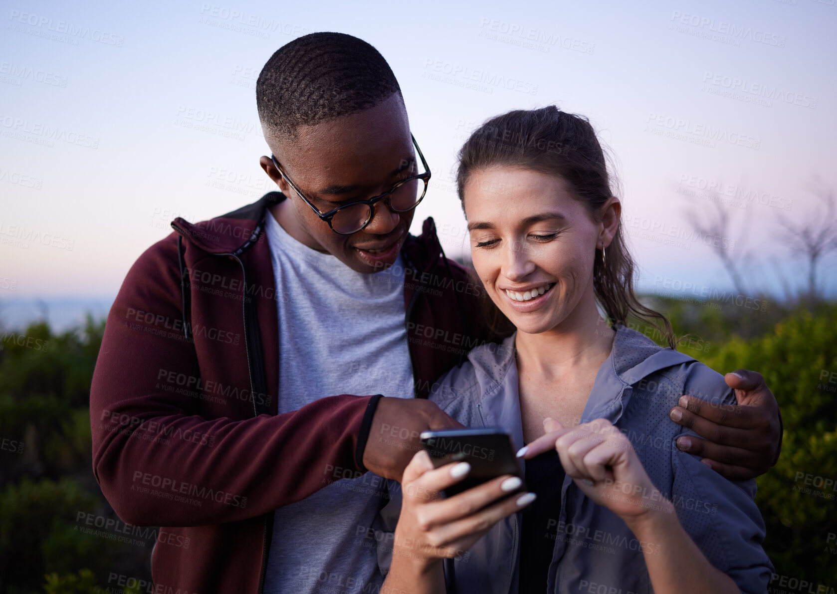 Buy stock photo Hiking, travel and couple with phone on mountain for location, gps mobile app and health tracking. Fitness, dating and interracial man and woman with smartphone for adventure, freedom and nature hike