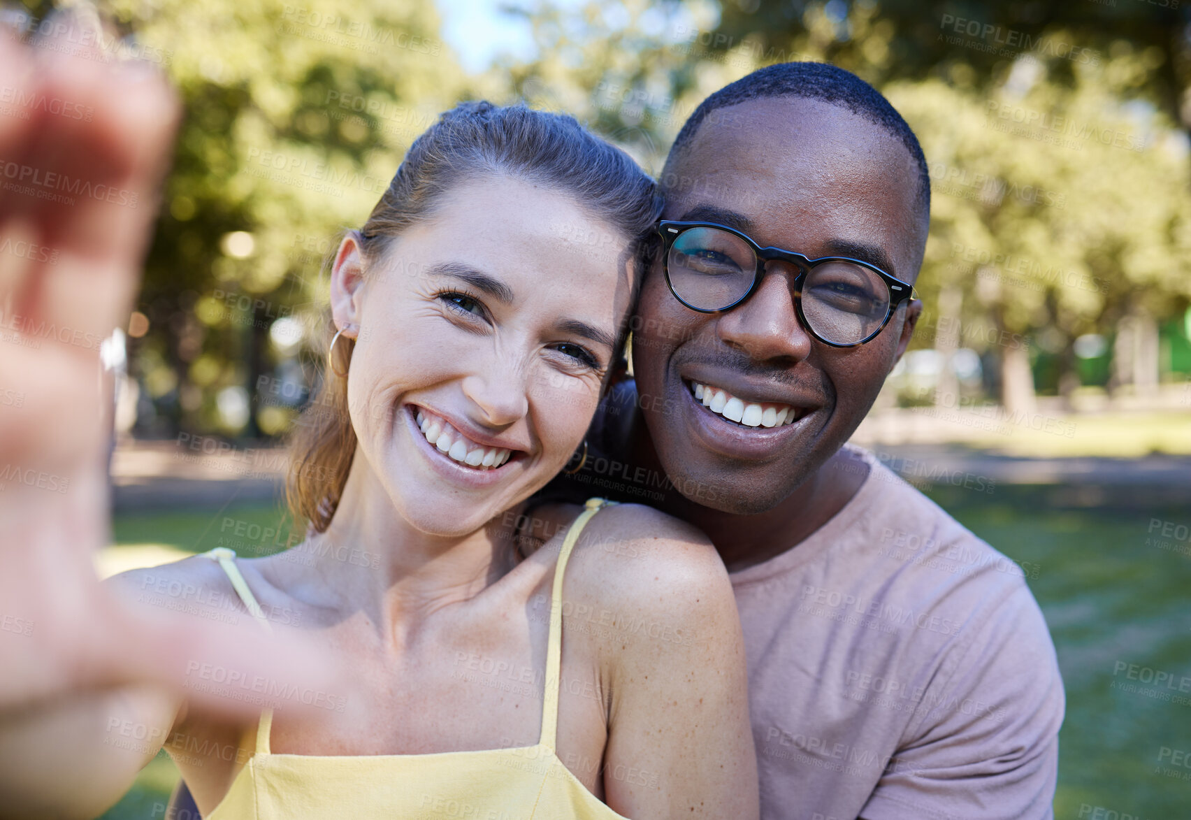 Buy stock photo Love, smile and selfie with interracial couple at park for relax, social media and peace on romantic date. Support, happy and quality time with black man and woman for bonding, calm and vacation