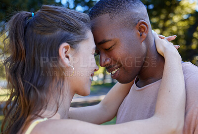 Buy stock photo Love, park and face with an interracial couple bonding or hugging outdoor together on a romantic date in nature. Summer, romance and diversity with a man and woman dating outside in a green garden