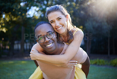 Buy stock photo Piggyback, portrait and happy couple in park for wellness in nature, interracial love and support in summer. Excited, freedom and smile black man with woman or people having fun together for a date