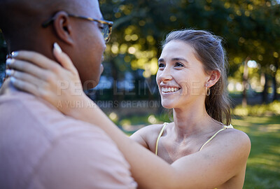 Buy stock photo Interracial love, couple and park for date, summer holiday and outdoor wellness with hug, care and commitment. Happy, young and diversity people in a green garden, nature and natural fun together