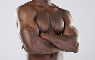 Buy stock photo Naked body, skin and black man, arms crossed and muscle, strong with fitness isolated on studio background. Muscular, bodybuilder and natural cosmetics, clean and fresh with skincare and nude