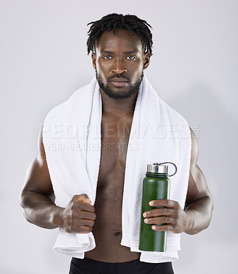 Buy stock photo Black man, exercise and portrait with towel and water bottle for sports training in studio. Health and wellness of a sexy male bodybuilder model with ready for fitness workout, goals and strong body