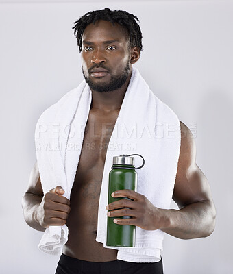 Buy stock photo Exercise, fitness and black man with a towel and water for sports training in studio. Health and wellness of a sexy male bodybuilder model thinking about workout, goal and body progress with a bottle