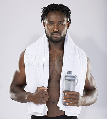 Buy stock photo Black man, towel and water for fitness portrait of sports person in studio for strong body. Health and wellness of sexy male bodybuilder model after exercise, workout and power training with a bottle