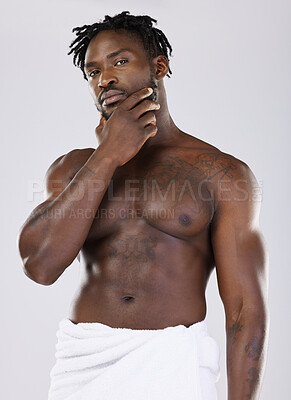 Buy stock photo Skin, black man in towel and muscle in portrait, shower with hygiene and beauty isolated on studio background. Abs, fitness and facial wellness, skincare glow and body care with natural cosmetics