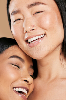 Buy stock photo Face, beauty and diversity with woman friends closeup in studio on beige background for skincare. Facial, model or cosmetic with a young female and attractive friend posing to promote a skin product
