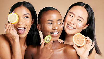 Buy stock photo Face, fruits and women in portrait with cream for facial care, beauty and natural cosmetics isolated on studio background. Sunscreen, vegan and different skin with skincare, moisturizer and playful