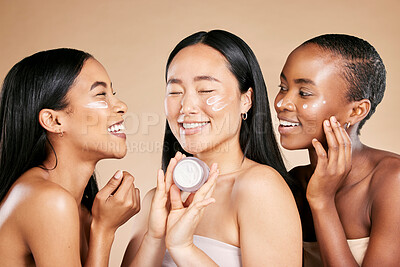 Buy stock photo Women, skincare cream and beauty friends with diversity for dermatology or cosmetic container. Asian and black people  group happy about skin glow, spa facial and face advertising self care product