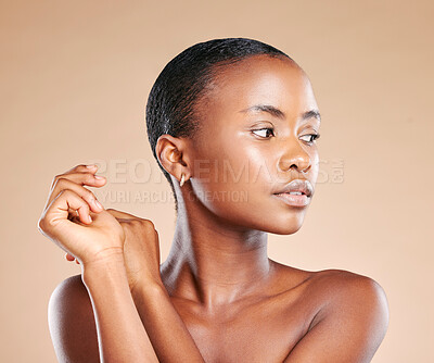 Buy stock photo Beauty, wellness and face of black woman in studio to promote luxury treatment, cosmetics and makeup. Spa aesthetic, skincare and female model on brown background for facial, shine and glowing skin