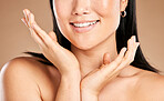 Mouth, skincare or happy woman with hands by face in grooming routine isolated on studio background. Wellness, relaxing or beautiful girl model smiles in luxury facial, self care or beauty treatment