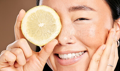 Buy stock photo Skincare, smile and portrait of a woman with a lemon for body detox, health and wellness. Vitamin c, food and happy Japanese model with a fruit for diet, nutrition and vegan beauty dermatology