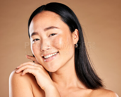 Buy stock photo Portrait, beauty and treatment with a model asian woman in studio on a beige background for natural skincare. Wellness, aesthetic or facial with an attractive young female posing to promote antiaging