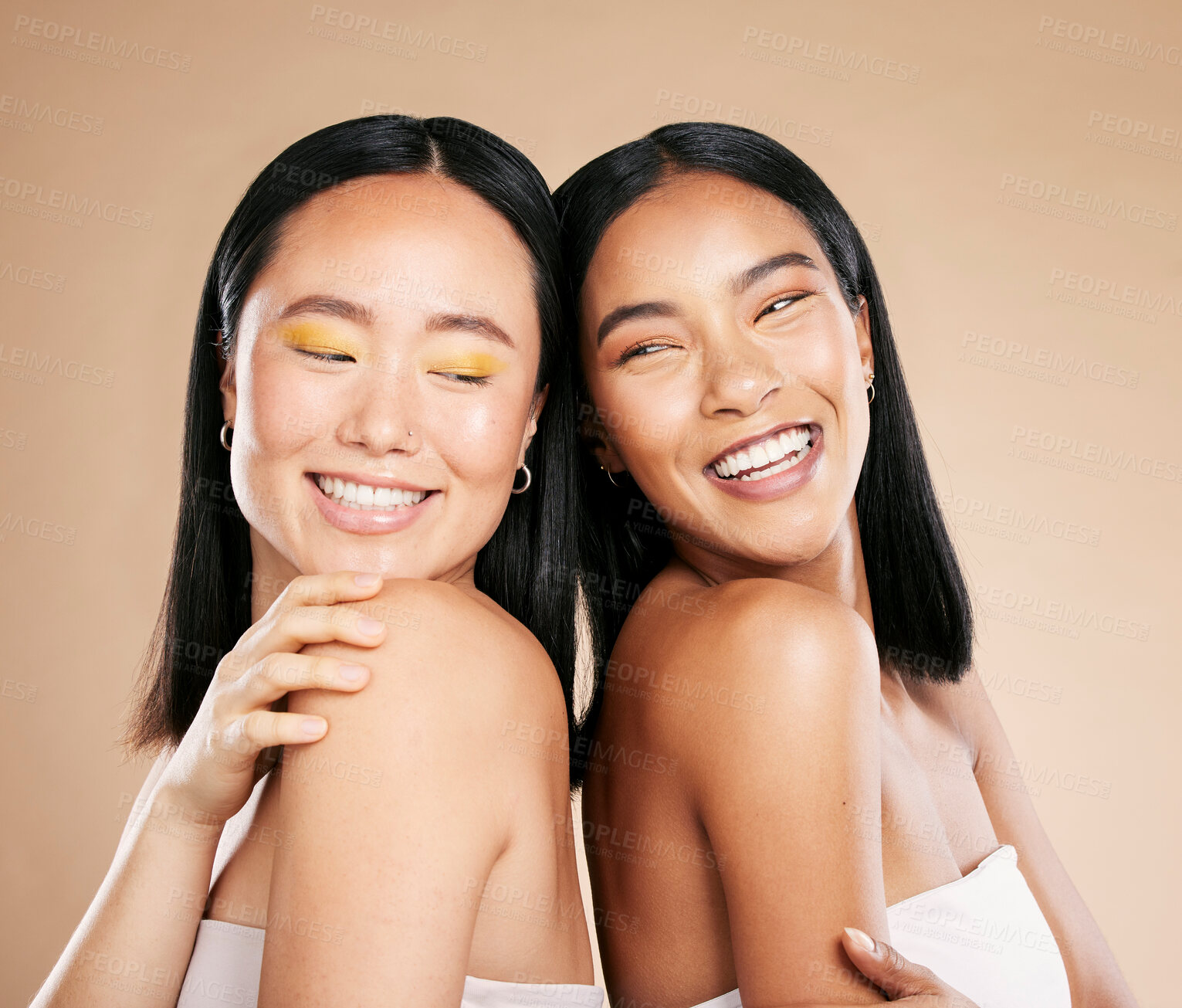 Buy stock photo Happy women, diversity and makeup for beauty, skincare and dermatology cosmetics in studio. Asian and black person friends together for skin glow, spa facial and luxury face cosmetic product 