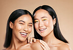 Portrait, beauty and diversity with woman friends in studio on a beige background for skincare. Face, skin and wellness with a young female and friend posing to model or promote a cosmetic product