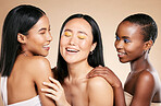 Happy, friends and beauty in studio for wellness, hygiene and creative grooming on brown background. Smile, women and eyeshadow by girl with different, skin and luxury skincare, relax and isolated 