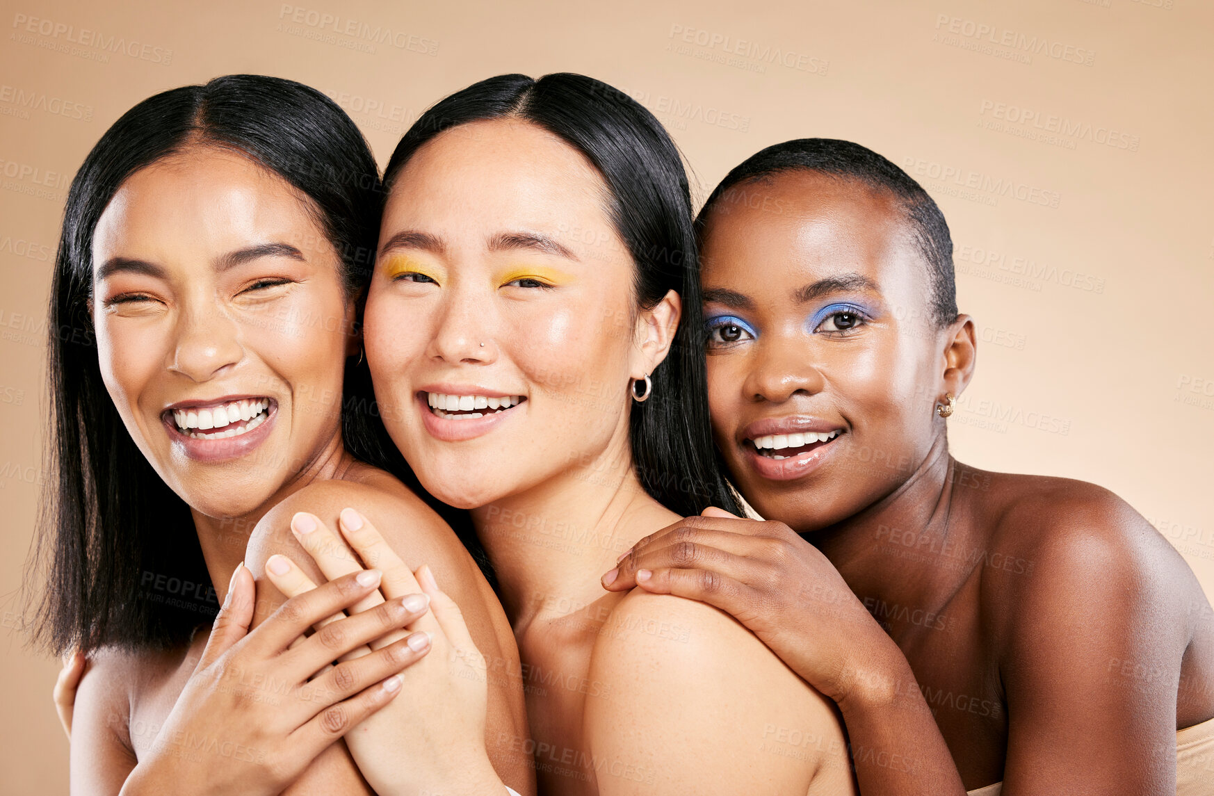 Buy stock photo Makeup, diversity and woman happiness together for support, facial wellness and cosmetics dermatology care in brown background studio. Model, smile and interracial beauty inclusion with skin glow