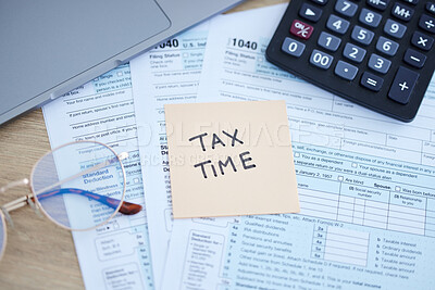 Buy stock photo Tax time, finance accounting and form for government law compliance, file income revenue return or self assessment. Taxation calculator, sticky note and financial audit paperwork for taxes payment