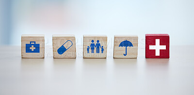 Buy stock photo Healthcare, insurance and wooden blocks in studio on an empty gray background for safety or security. Abstract, medicine and health with block toys in a hospital or clinic for medical care