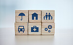 Wooden, cubes or stack in house risk management, security or future protect on background desk mockup or home table. Zoom, building blocks or life insurance in medical, car loan or mock up cog wheel