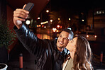 People, phone and night selfie kiss on cheek on city street, social media or profile picture in birthday celebration vlog. Happy smile, bonding or couple of friends on mobile photography tech in dark